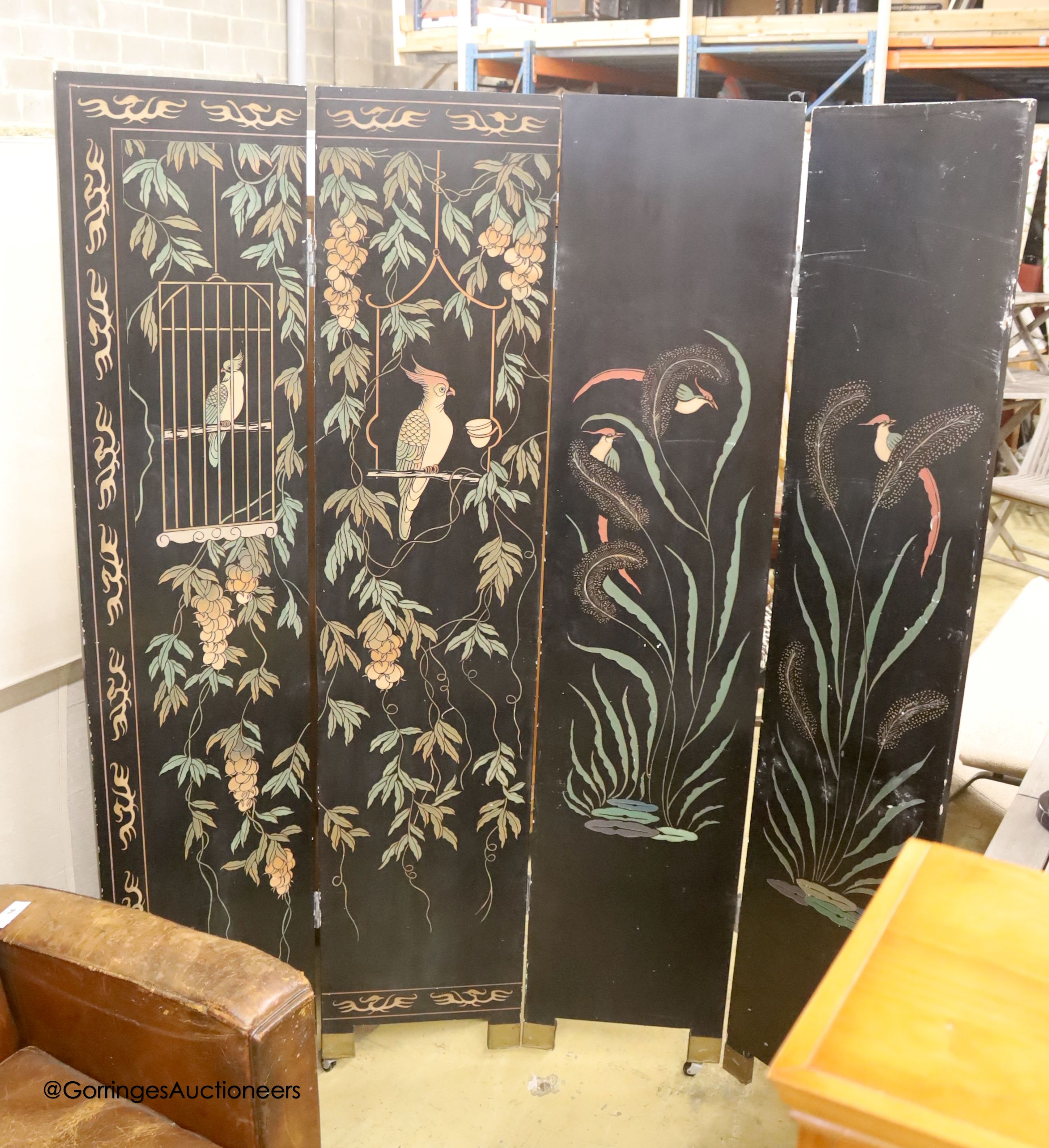 A Chinese ebonised four fold draught screen, painted each side with exotic birds and foliage, each panel width 40cm, height 187cm